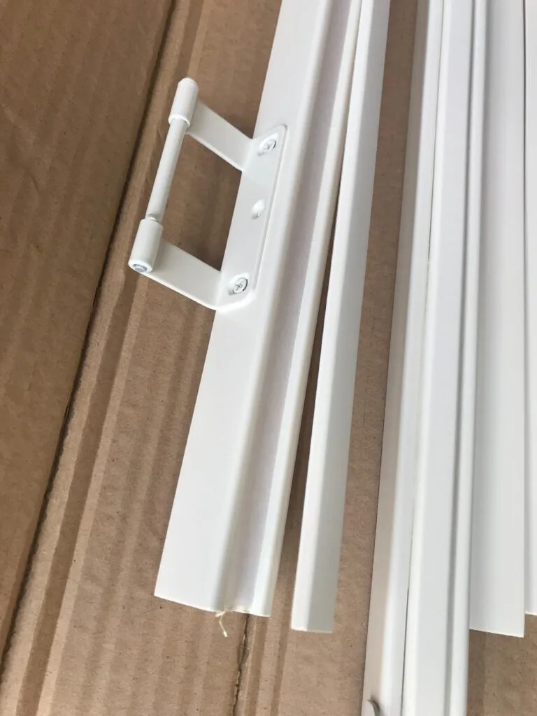 2 peel screw tidy-min Removing screw covers from a hang strip shutter