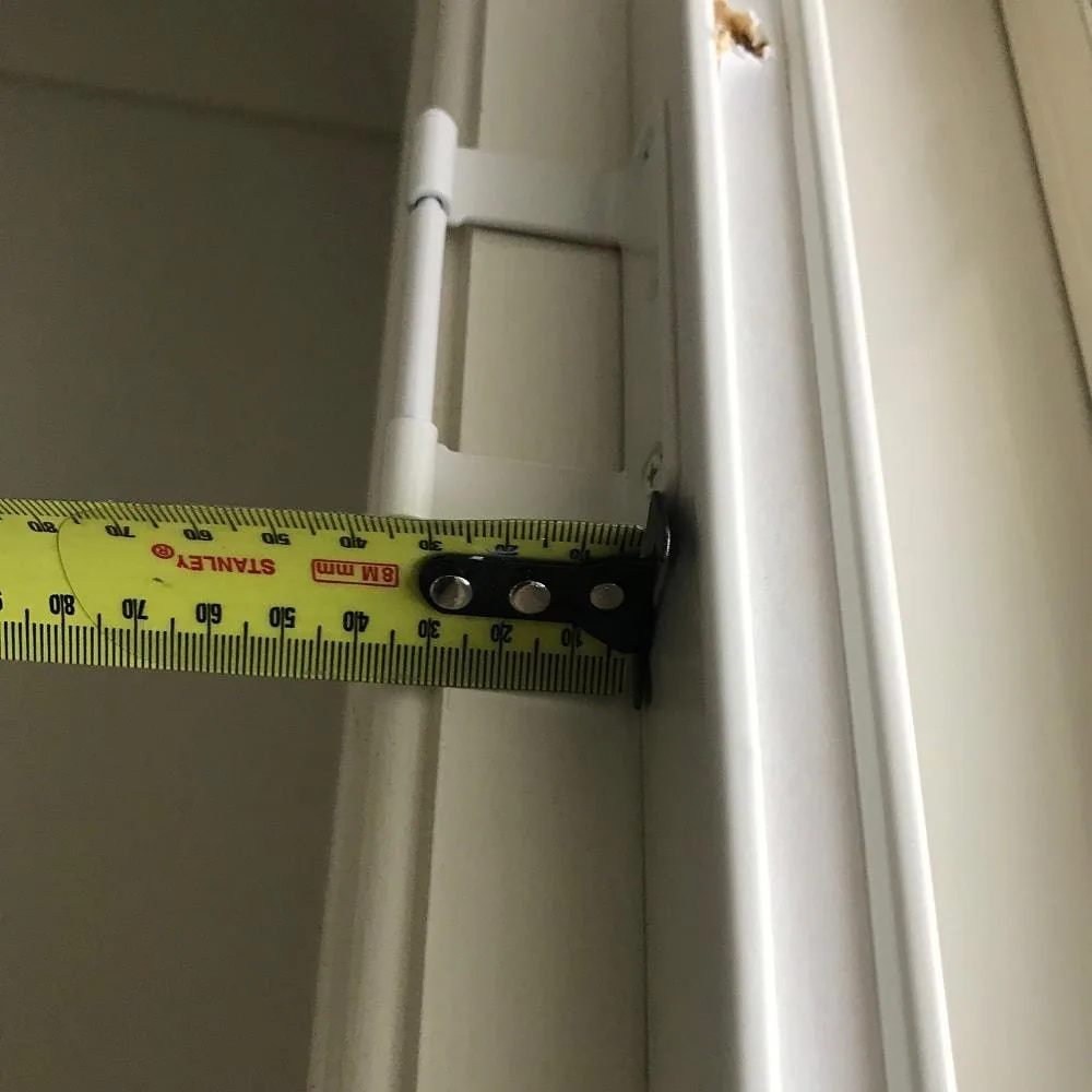 7 measure fixed side for opposite side-min Measuring the fixed hang strip side before installing the opposite side