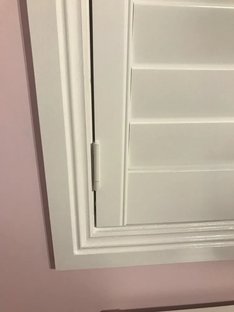 DIY Frameless 1-min Frameless plantation shutter installed on hang strips without a frame