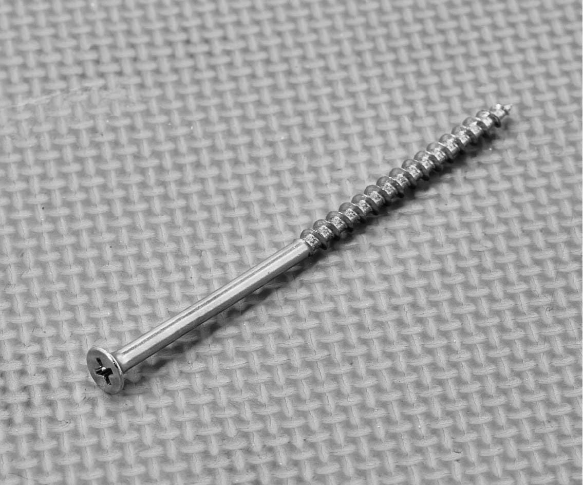 Plantation shutter assembly screw showing its countersunk head, shaft and thread