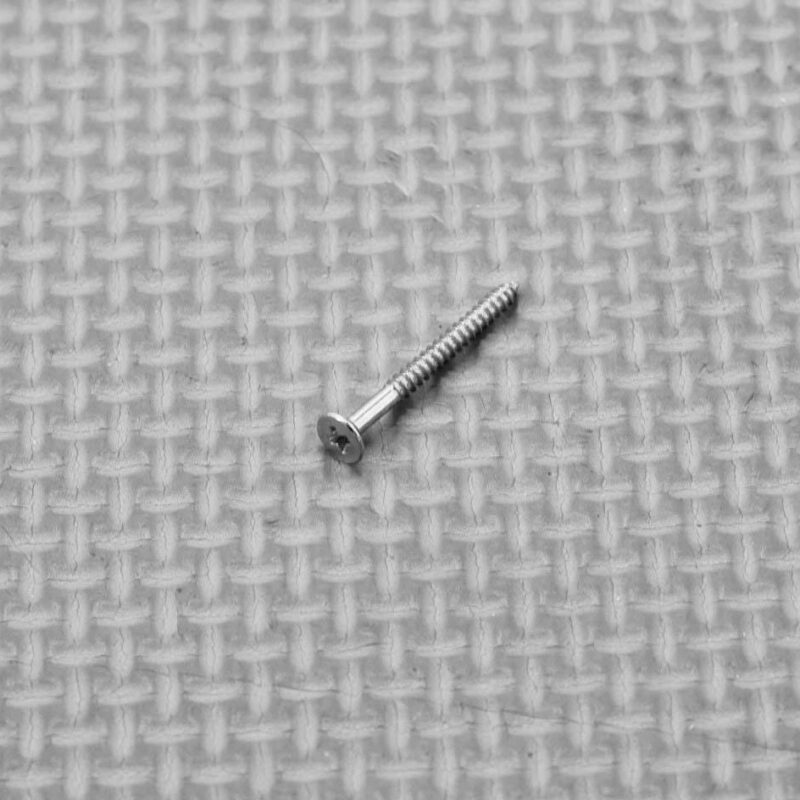 Plantation shutter louvre tilt rod screw showing its head and thread