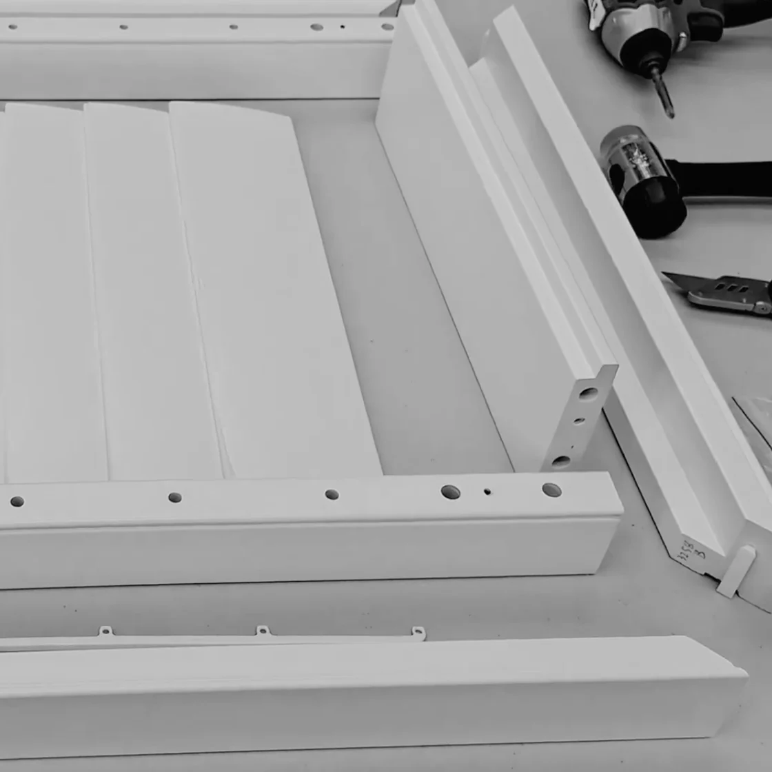 Flat-packed EasyKit DIY shutter components ready for assembly